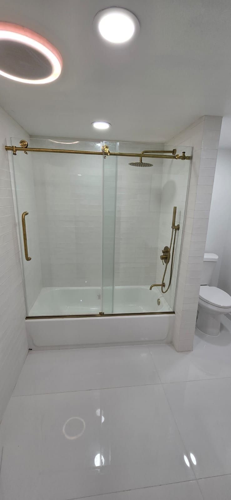 A modern bathroom with a glass shower enclosure