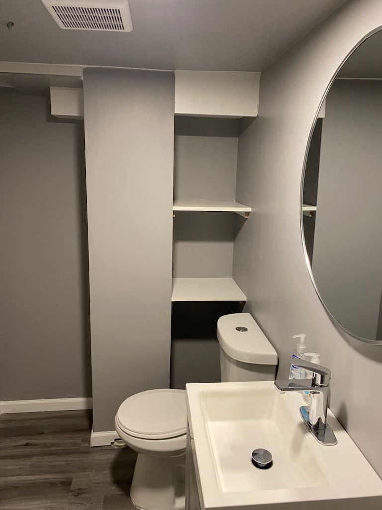 Small bathroom with a toilet, sink.