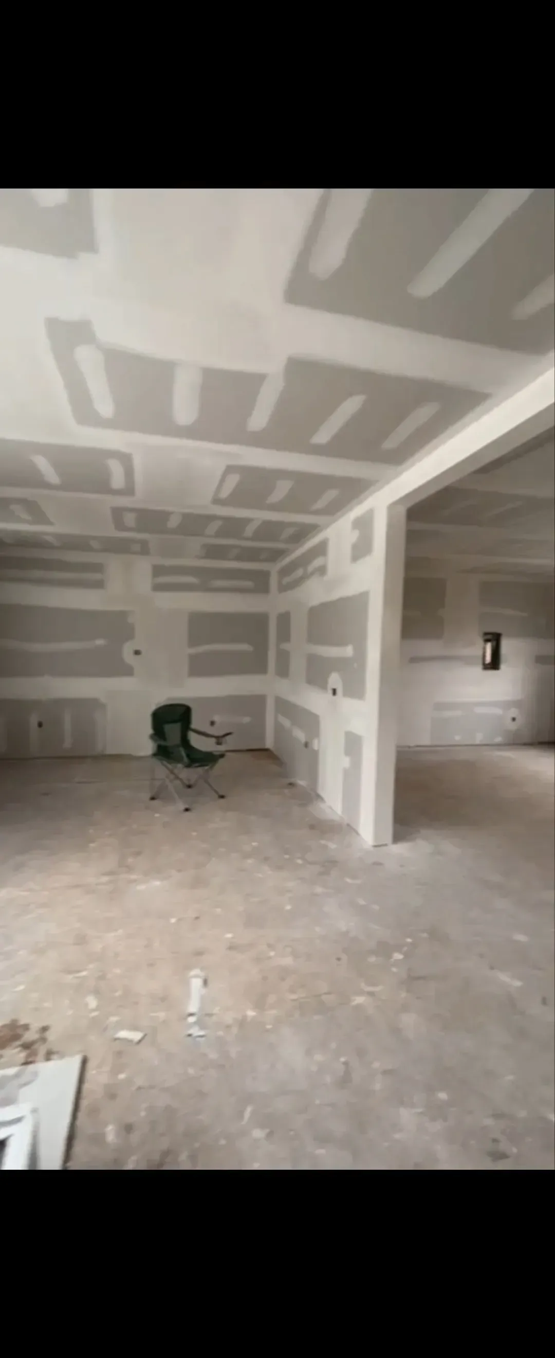 A large room with a lot of drywall on the walls and ceiling