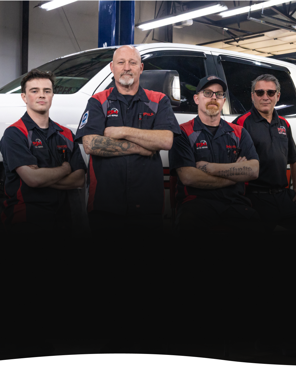 Mechanic working on an engine | PJM Auto LLC