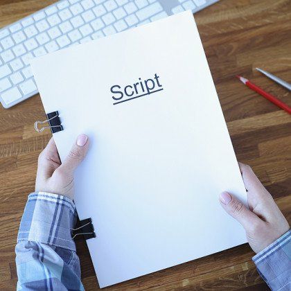 Script writer holding a script