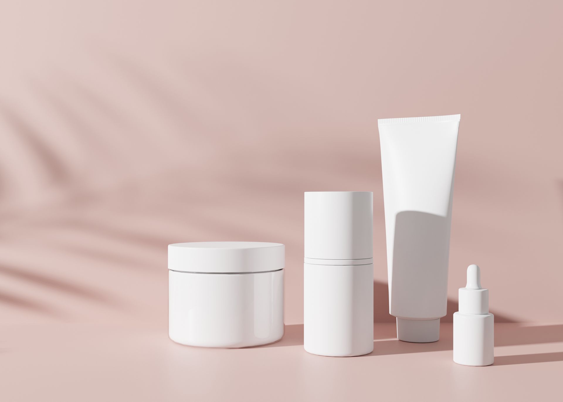 skincare products on pink background