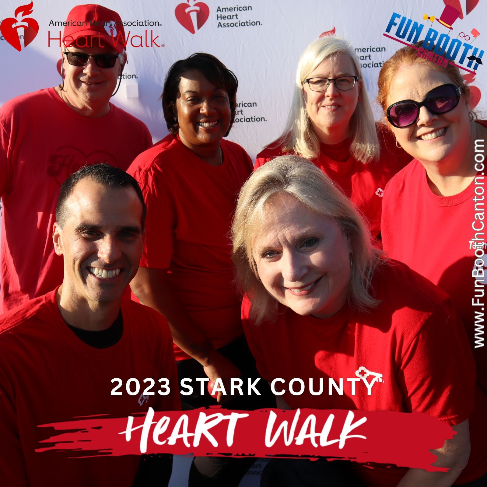 Group of people in red shirts at the 2023 Stark County Heart Walk. Smiling, posing for a photo.