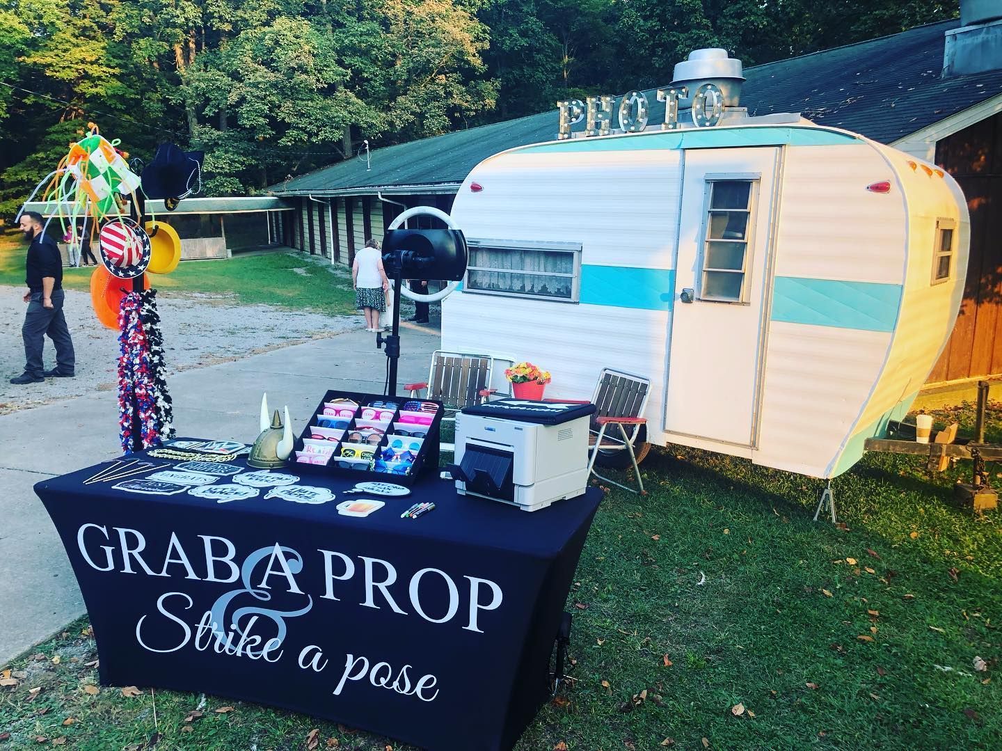 Photo booth in a vintage camper with props and 