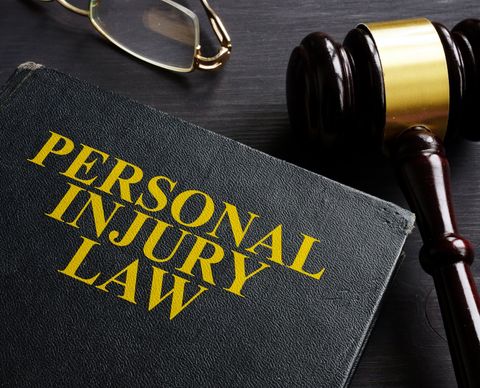 Personal Injury Law Book and Gavel — New City, NY — Alan J. Binger, Esq.