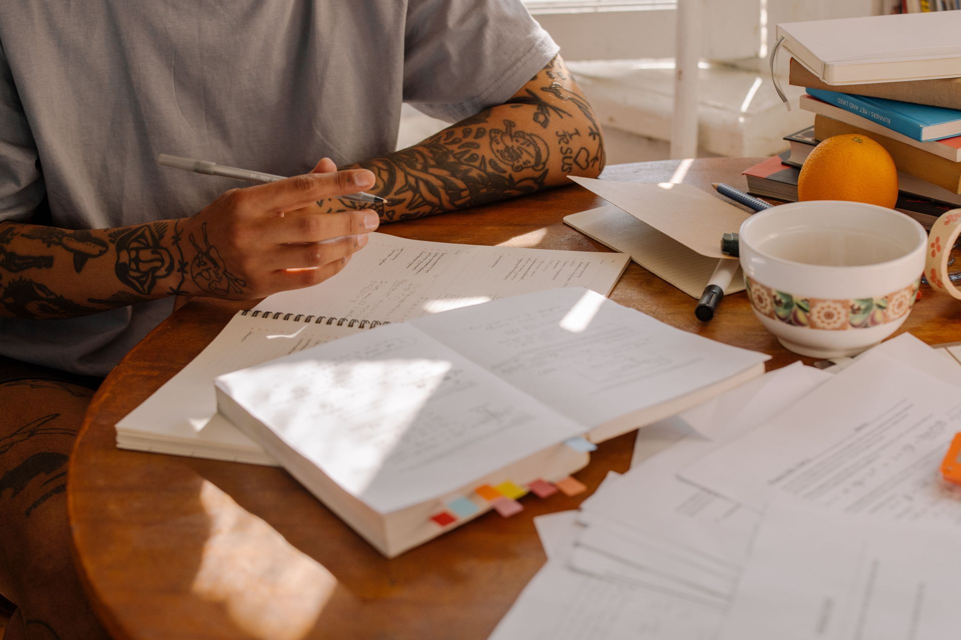 Student Studying Notes in Off-Campus Housing