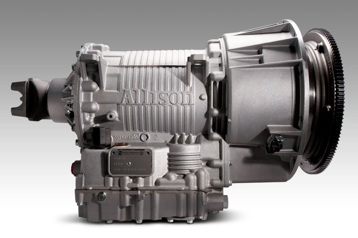 A close up of an allison transmission on a white background