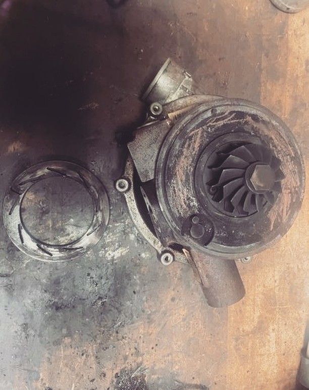 A close up of a turbocharger on a table.