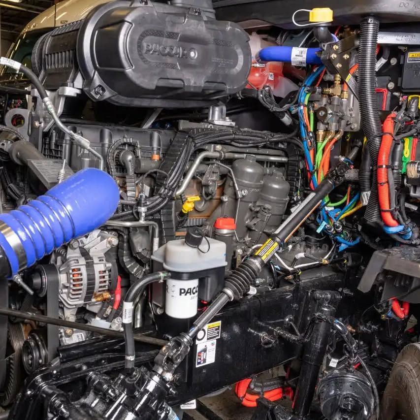 A close up of a tractor engine with the word pac on it