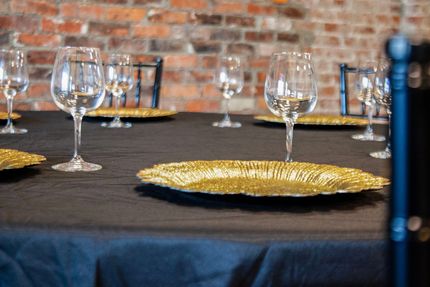 At the Rochester seating is available with 8 foot round tables and black chairs.