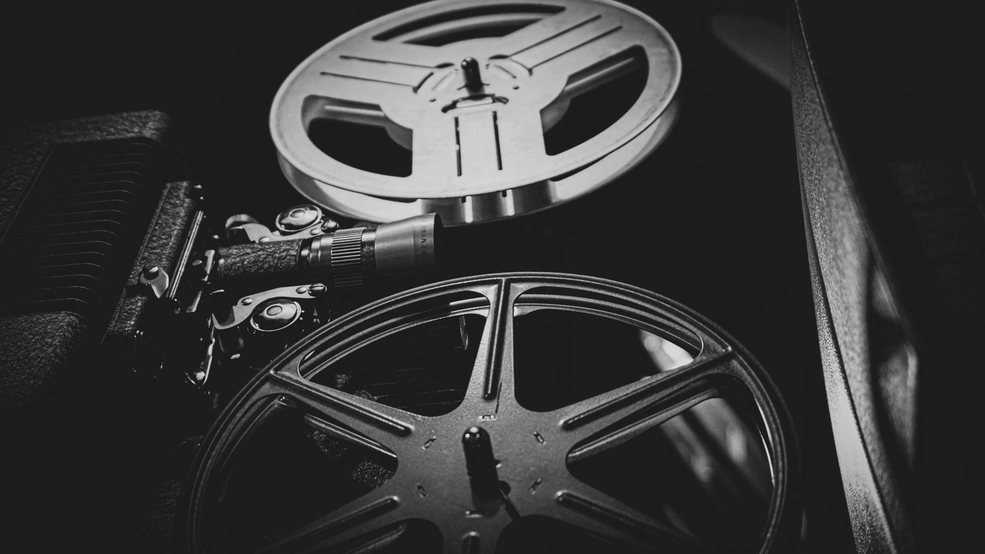 A black and white photo of a film reel