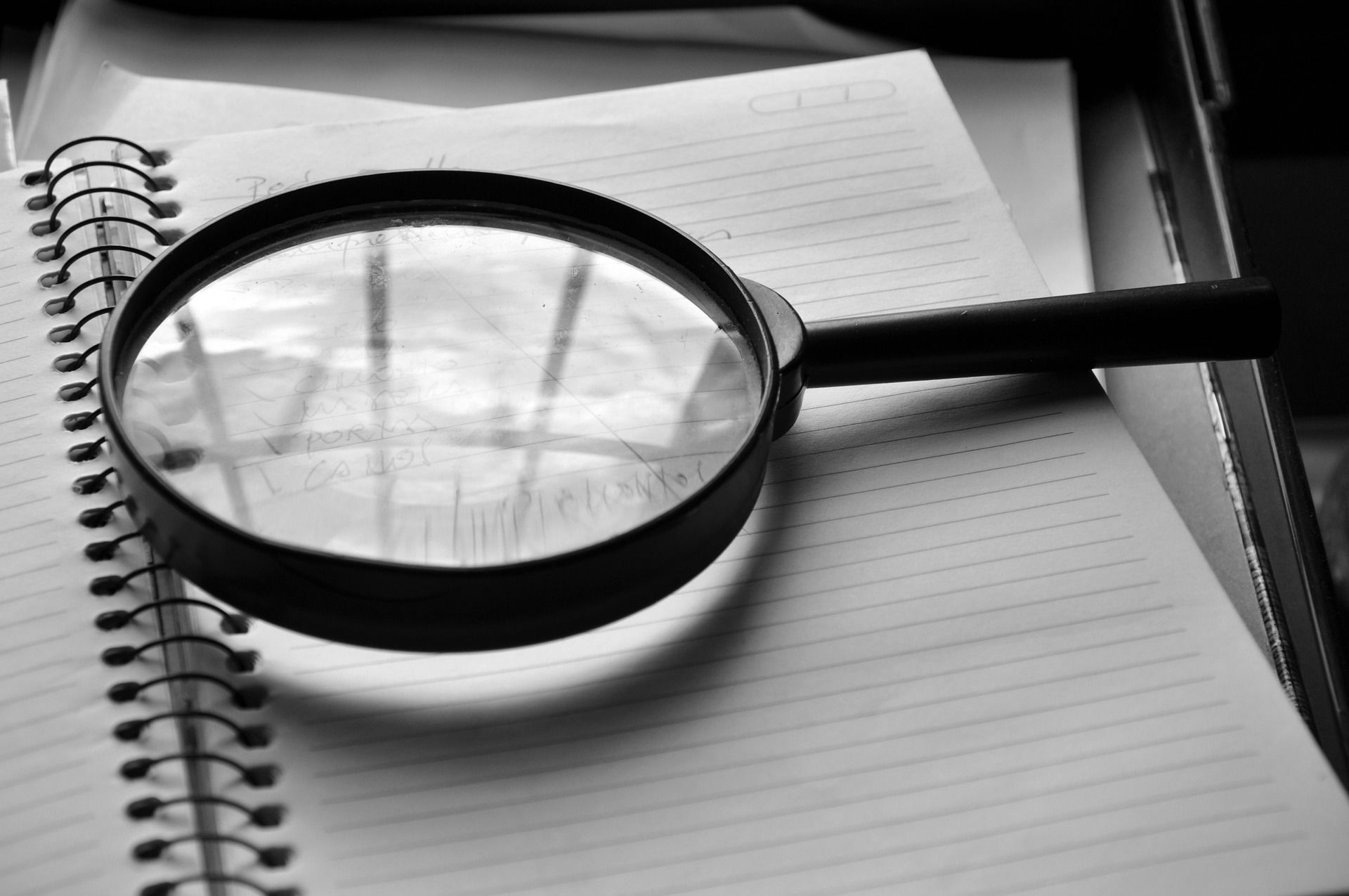 Magnifying glass on a writing pad