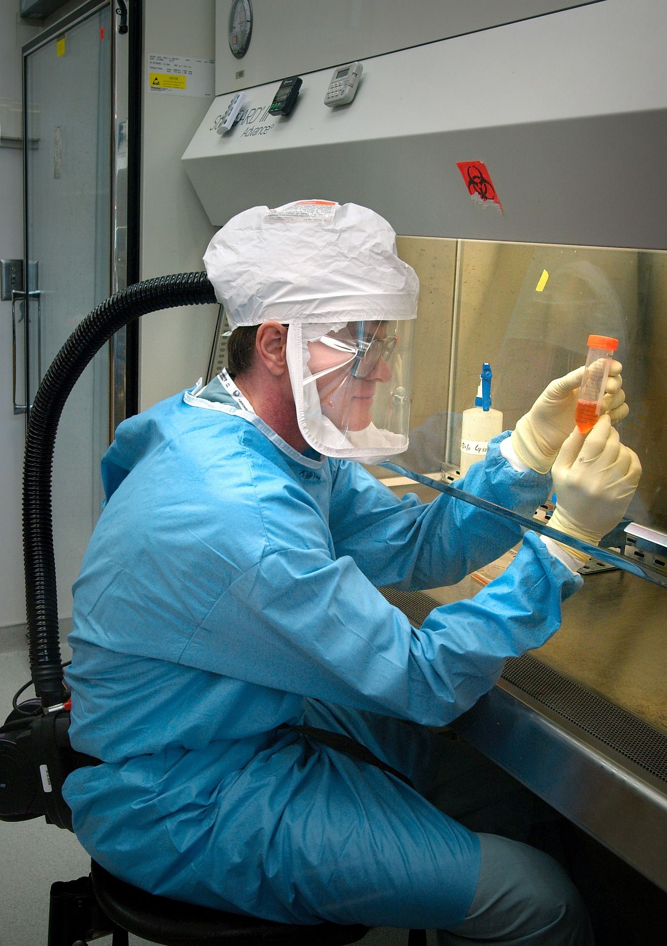 Man wearing protective clothing in a laboratory