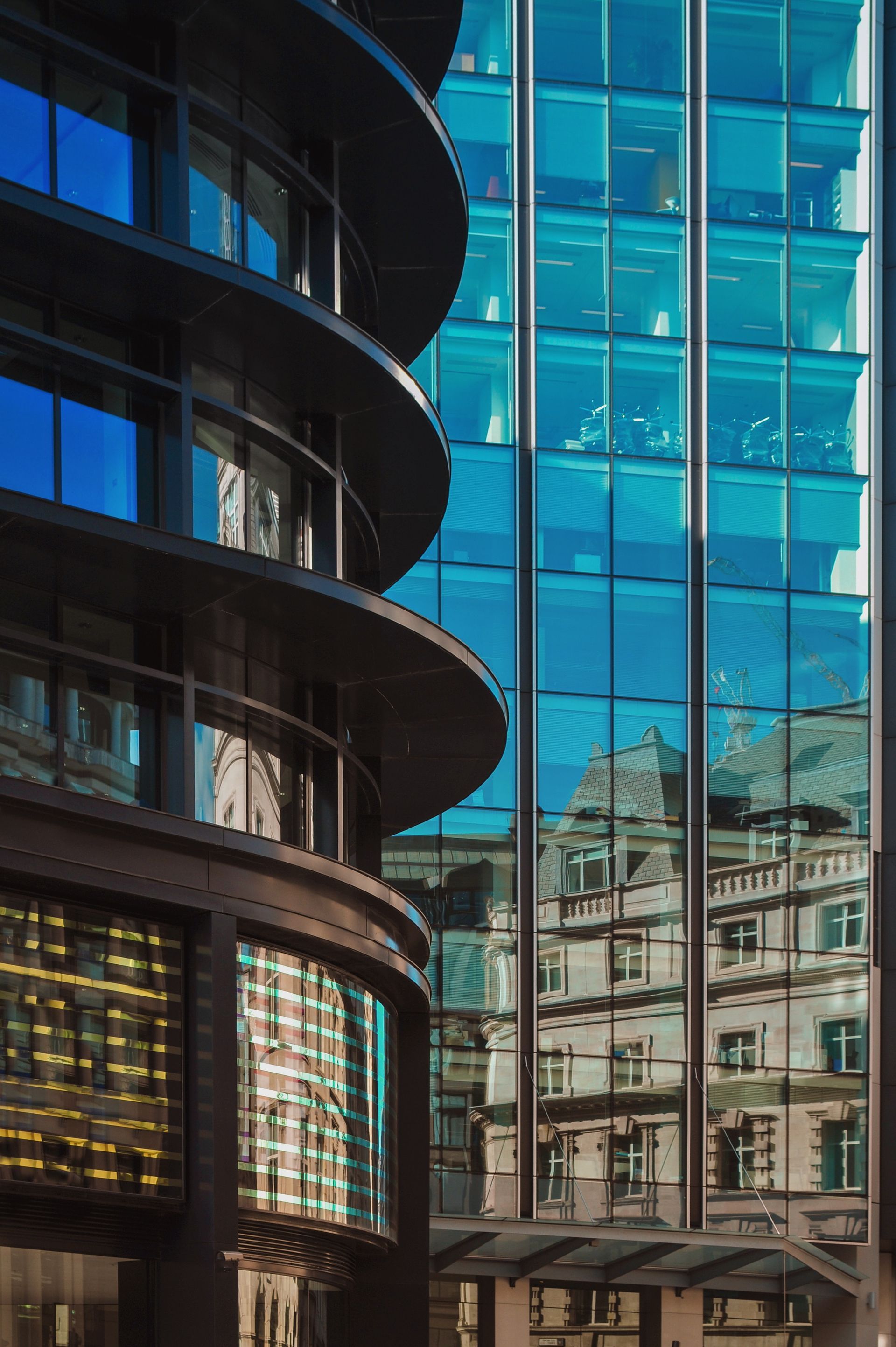 Close up image of a couple of glass fronted office buildings