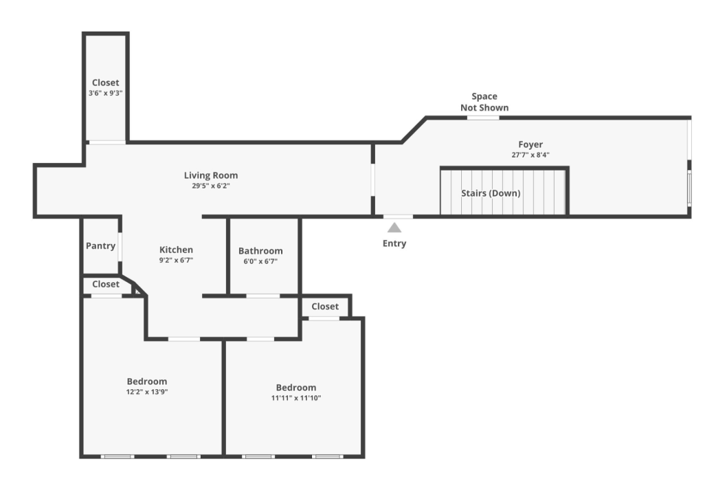 Floor plan of a house, showing rooms and layout. Includes living room, bedrooms, bathroom, and stairs.