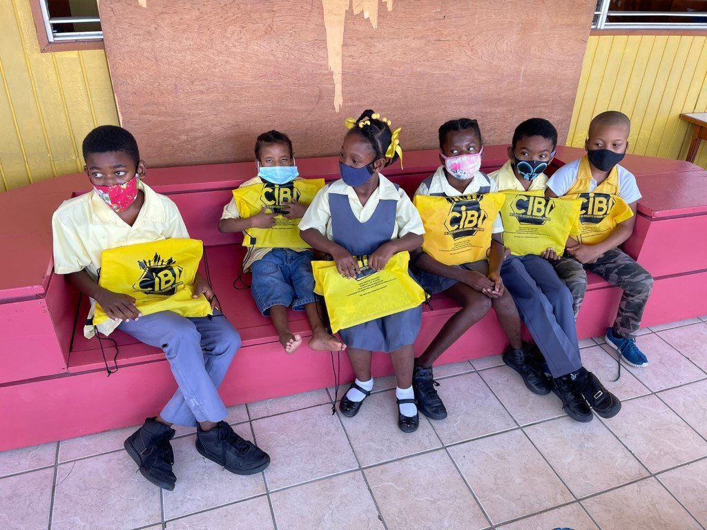 Children Holding School Supplies From The Summer Camp