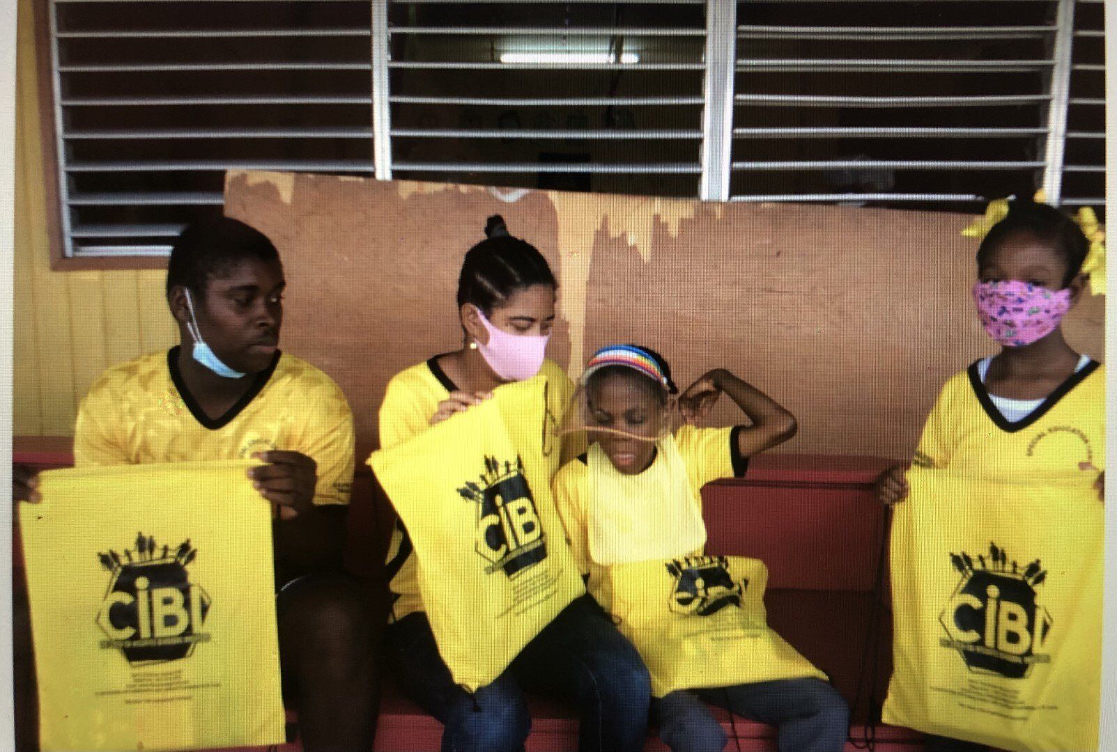 Special Education Center Students Showing Their Schools Supplies