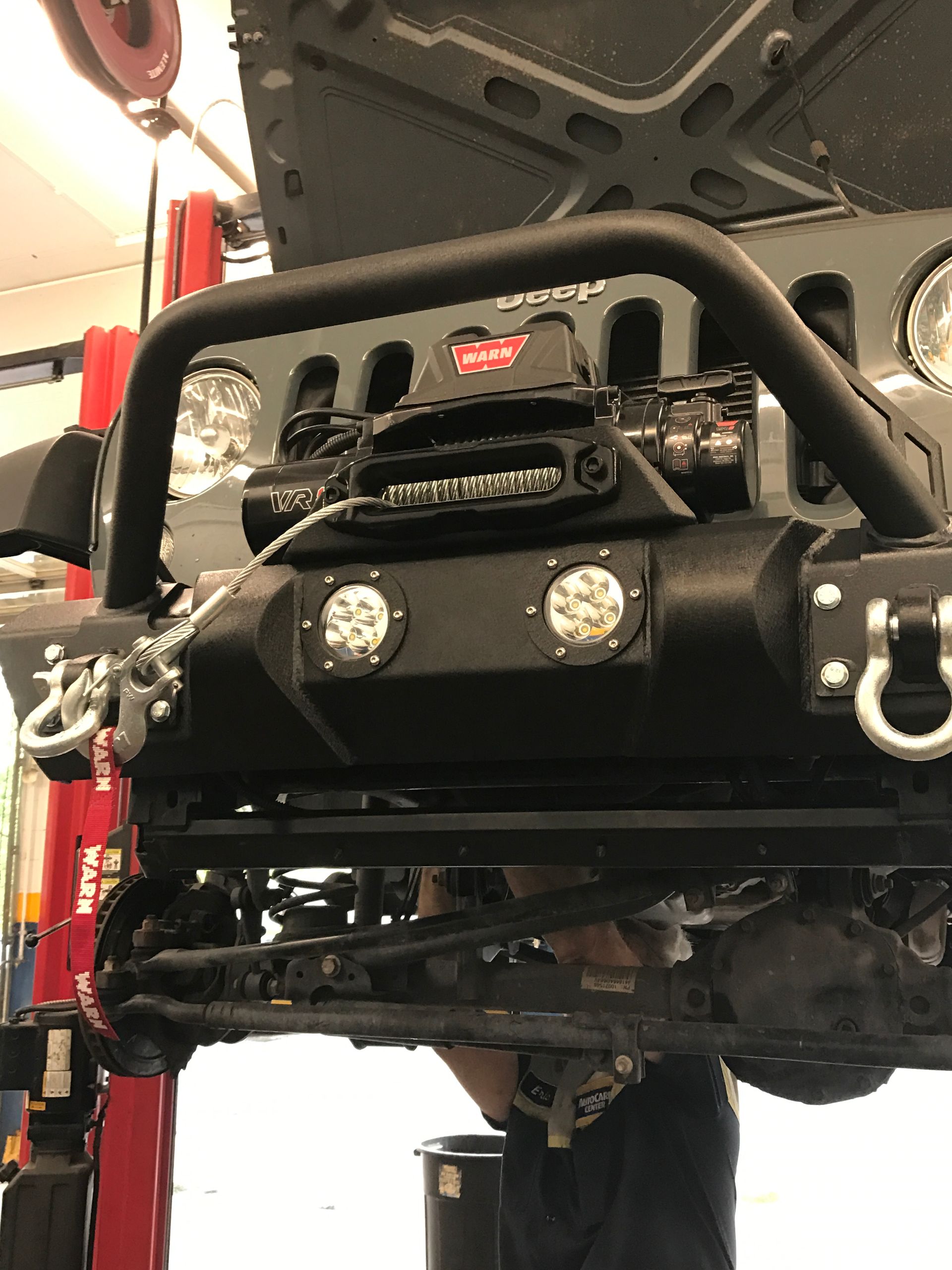 Our Mechanic is Working on a Jeep With Hood Up in Jacksonville, FL - Mr. Best Wrench