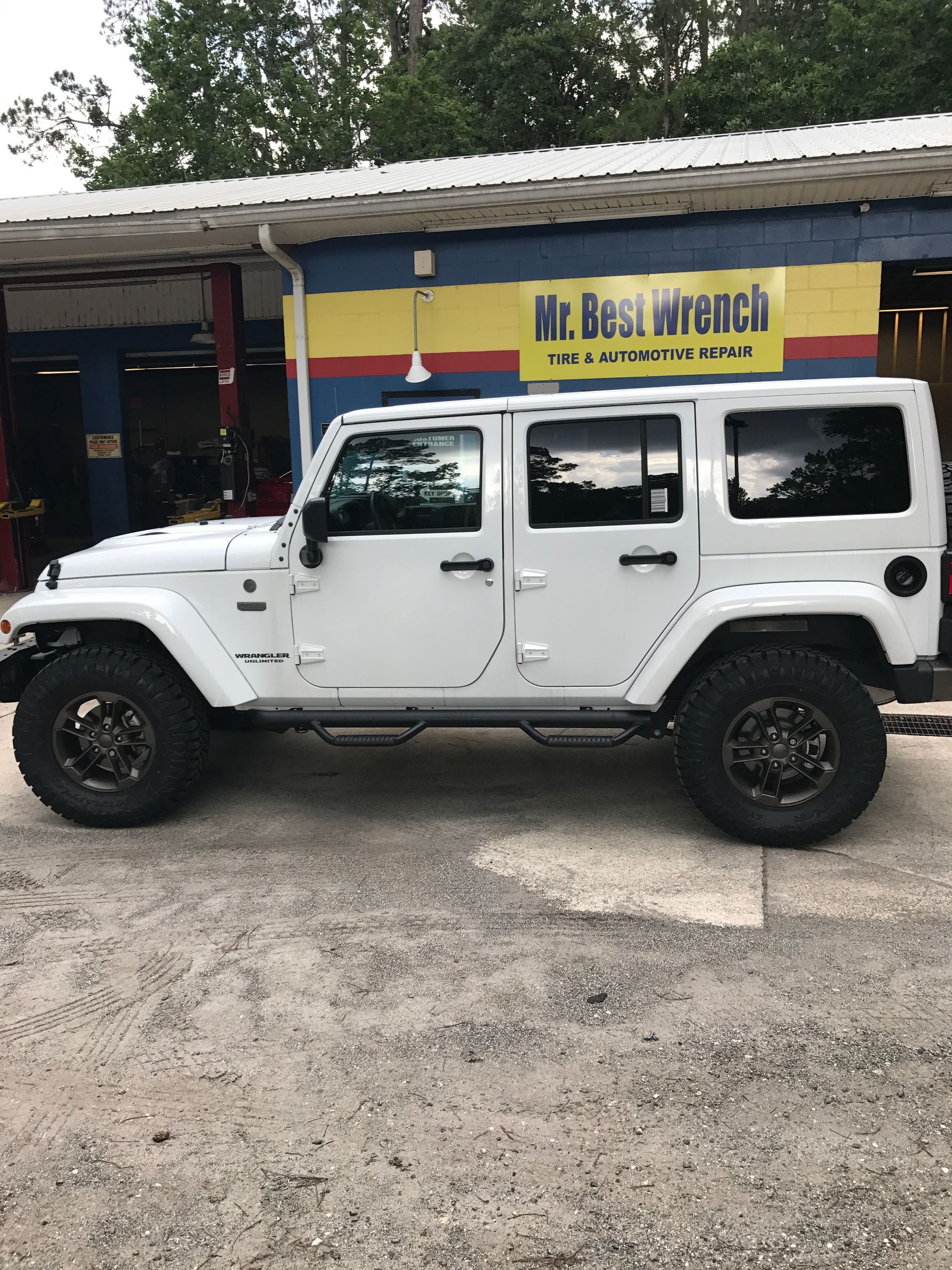 The White Jeep is Parked in Front of Our Door in Jacksonville, FL - Mr. Best Wrench