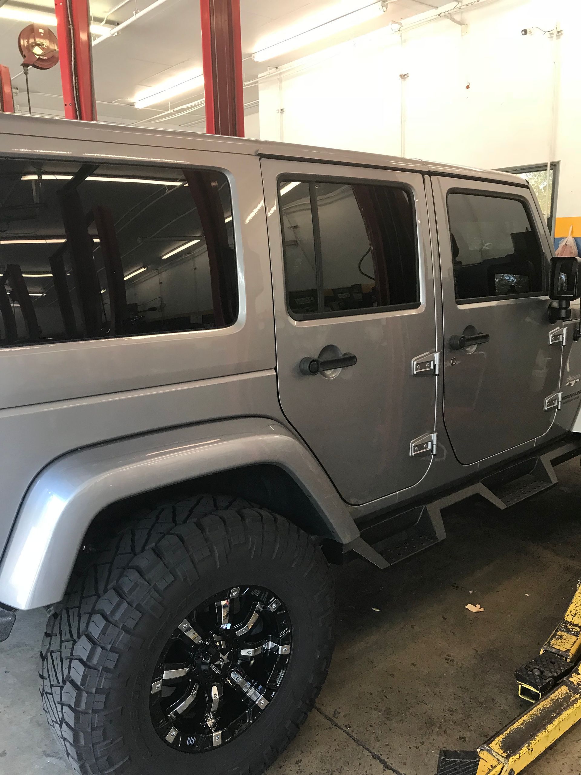 A Silver Jeep Parked in Our Service Shop in Jacksonville, FL - Mr. Best Wrench