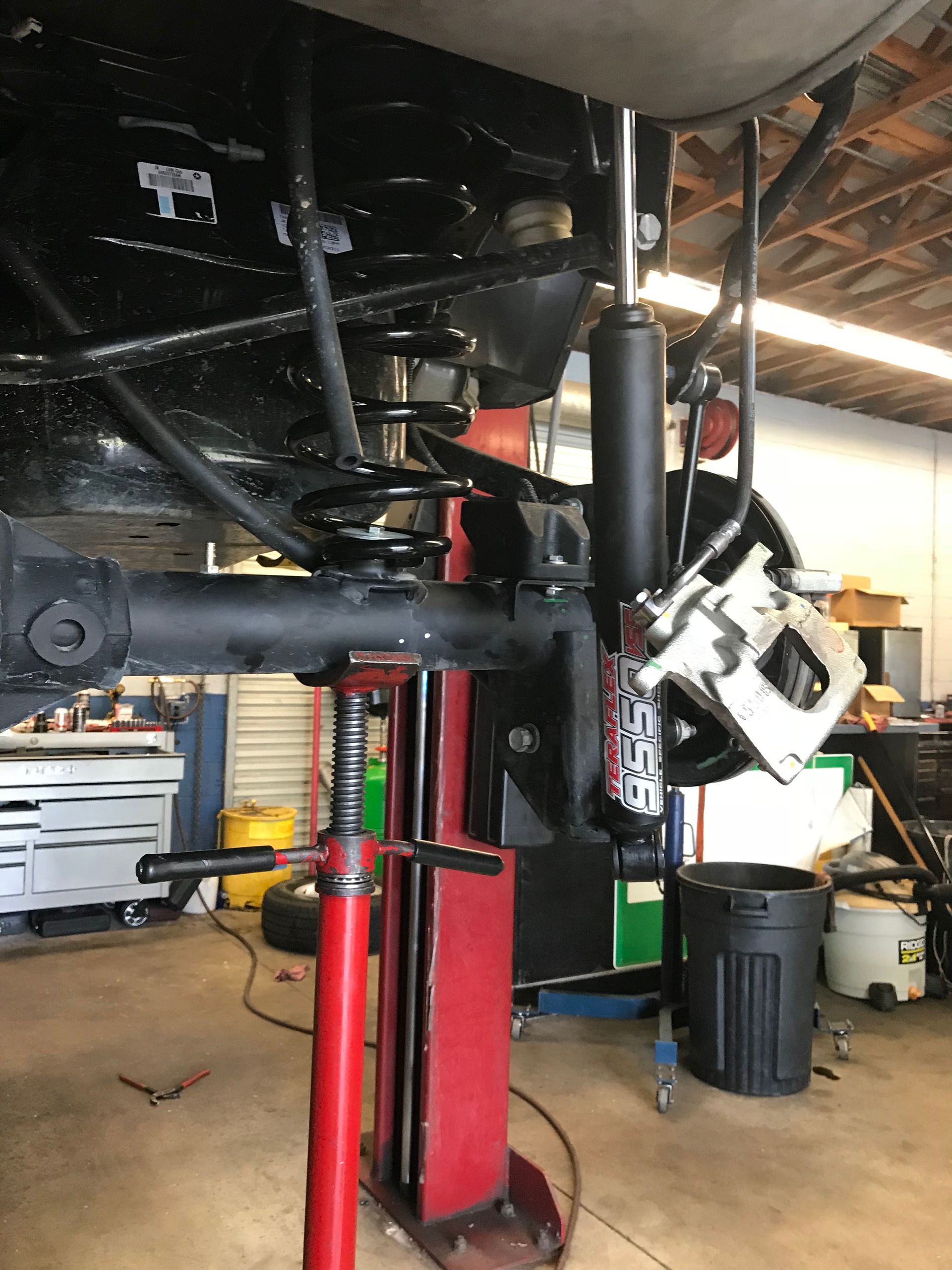 Checking Shocks and Struts on the Lift at Mr. Best Wrench