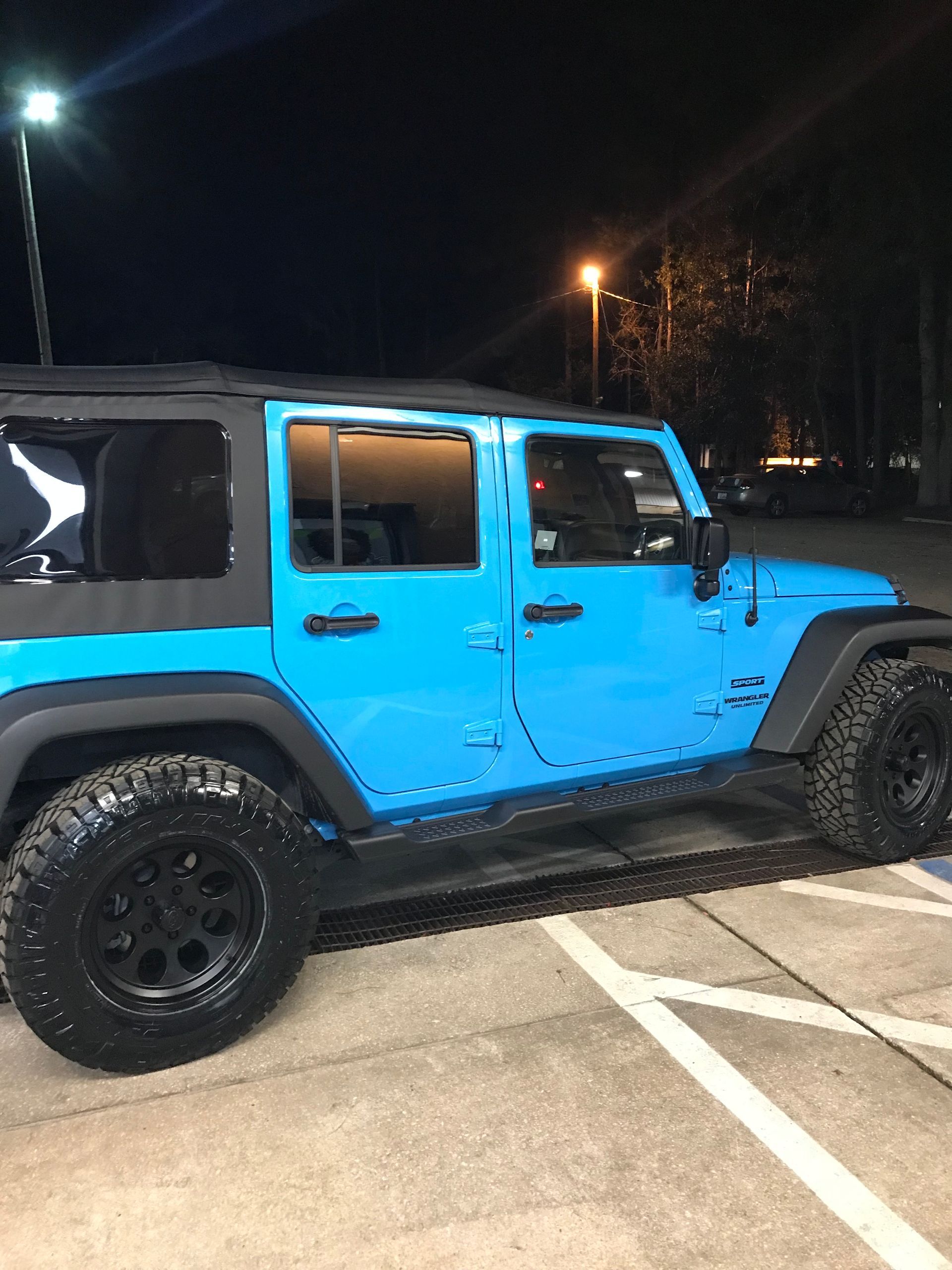 A Blue Jeep is Parked in Front of Mr. Best Wrench
