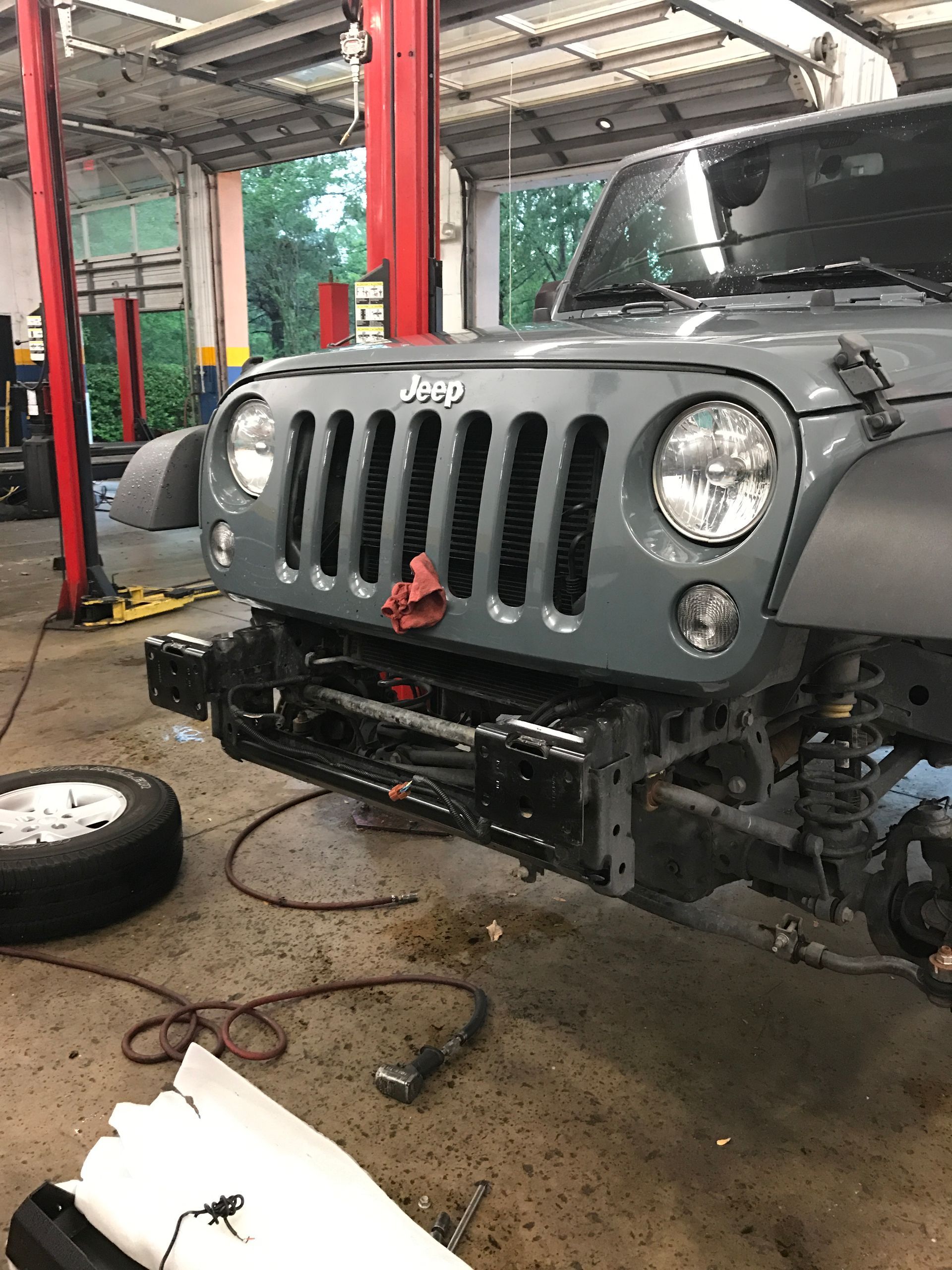 A Jeep is Being Worked on a Garage in Jacksonville, FL - Mr. Best Wrench