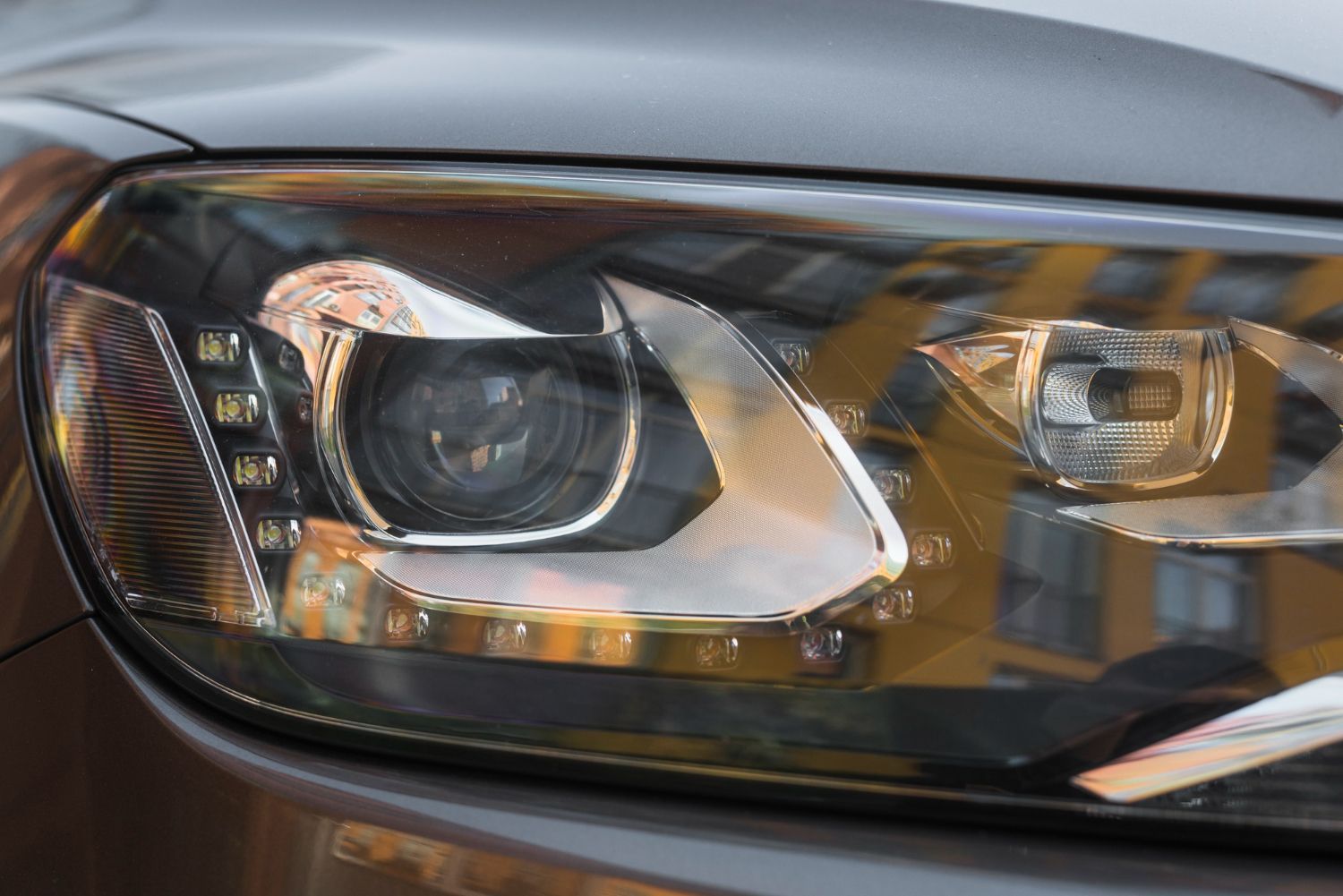 A close up of the headlight of a car.