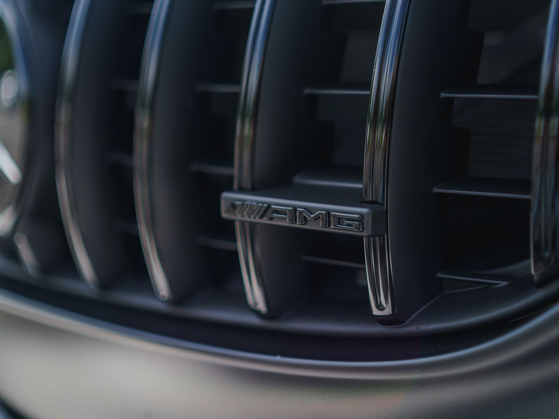 A close up of the front grille of a mercedes benz amg.