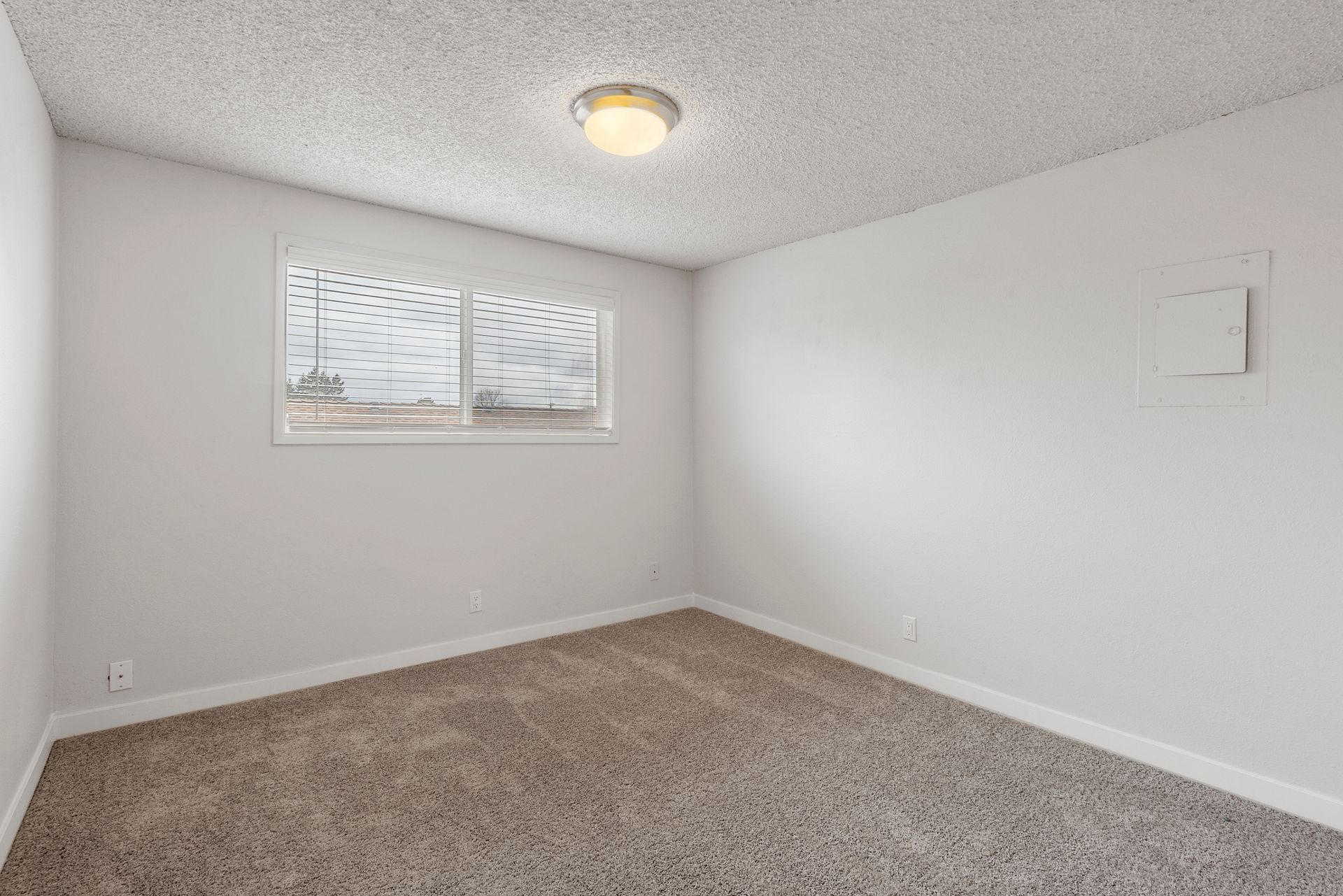 There is a window in the corner of the room.