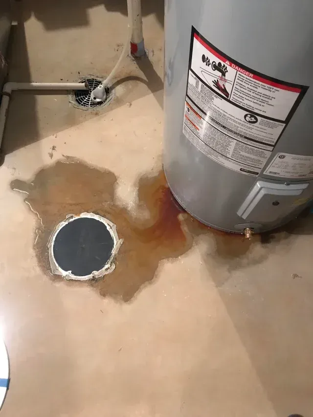 Water heater leaking onto the floor.
