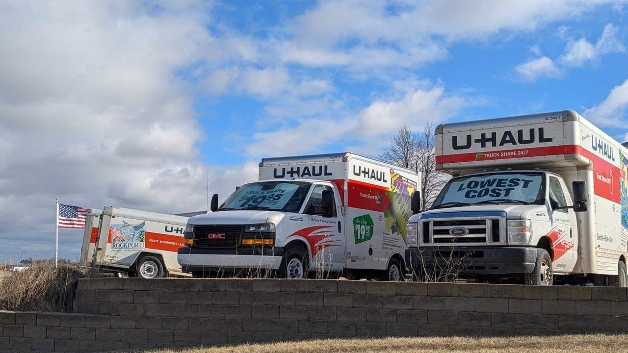 Three U-Haul trucks parked outdoors on a sunny day with blue sky | Kerp's Service Center