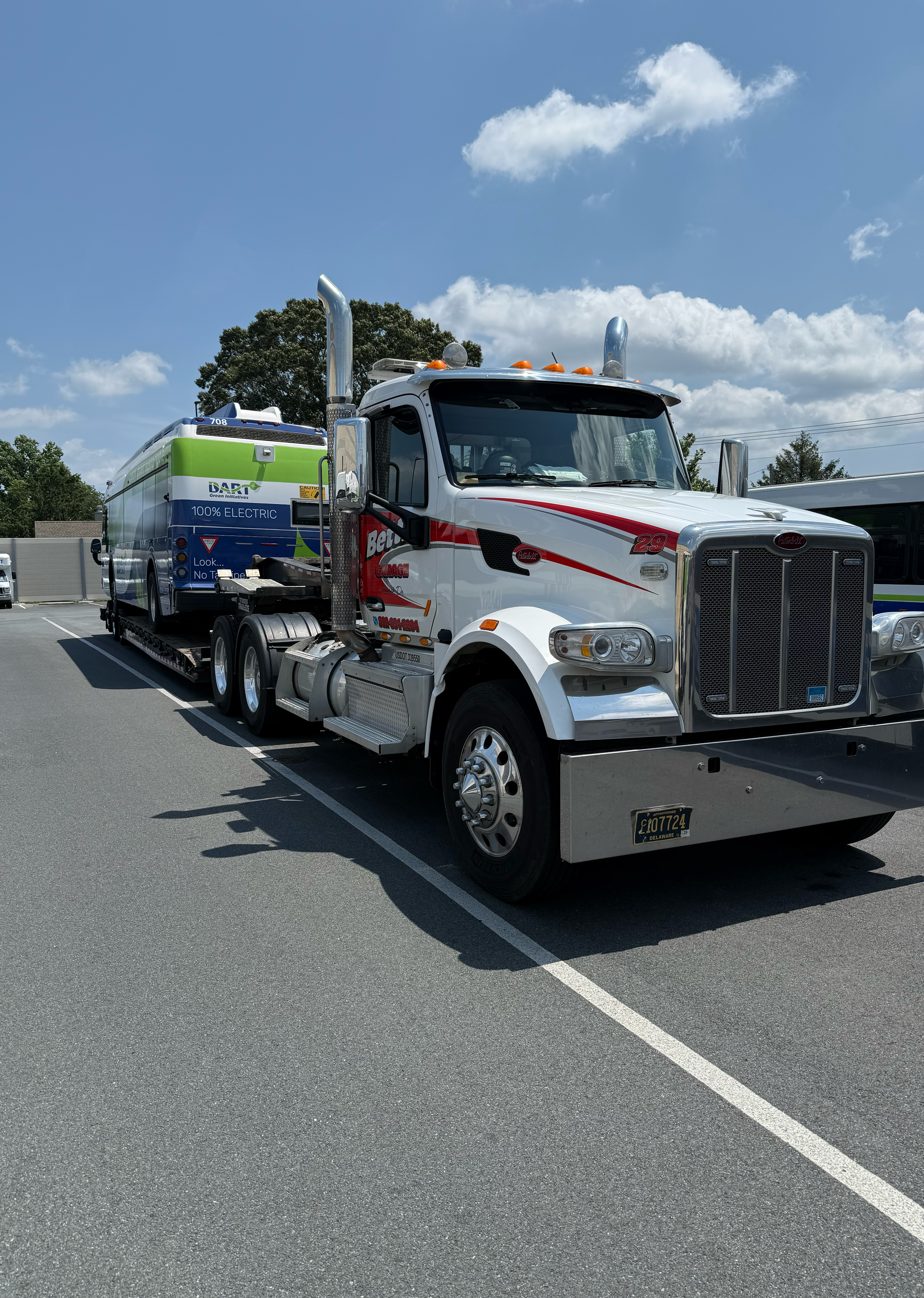 Betts Garage hauling truck parked outdoors on a sunny day