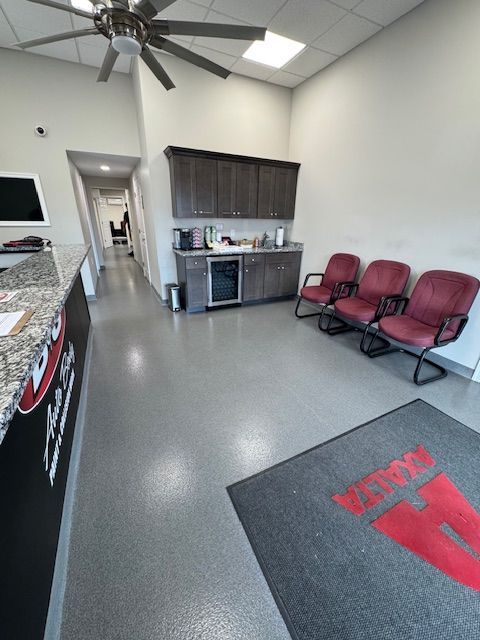 B&G Auto Body office waiting area with seating and reception counter
