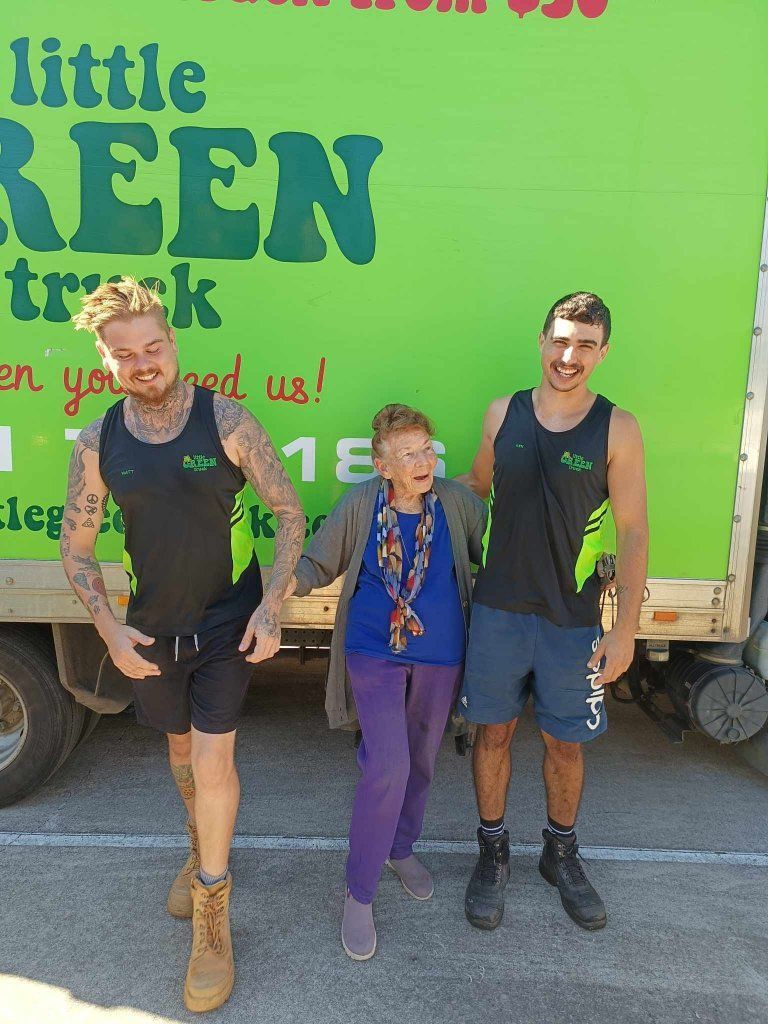 Three Men and a Woman Are Standing in Front of a Green Truck — Little Green Truck Port Macquarie in Port Macquarie, NSW