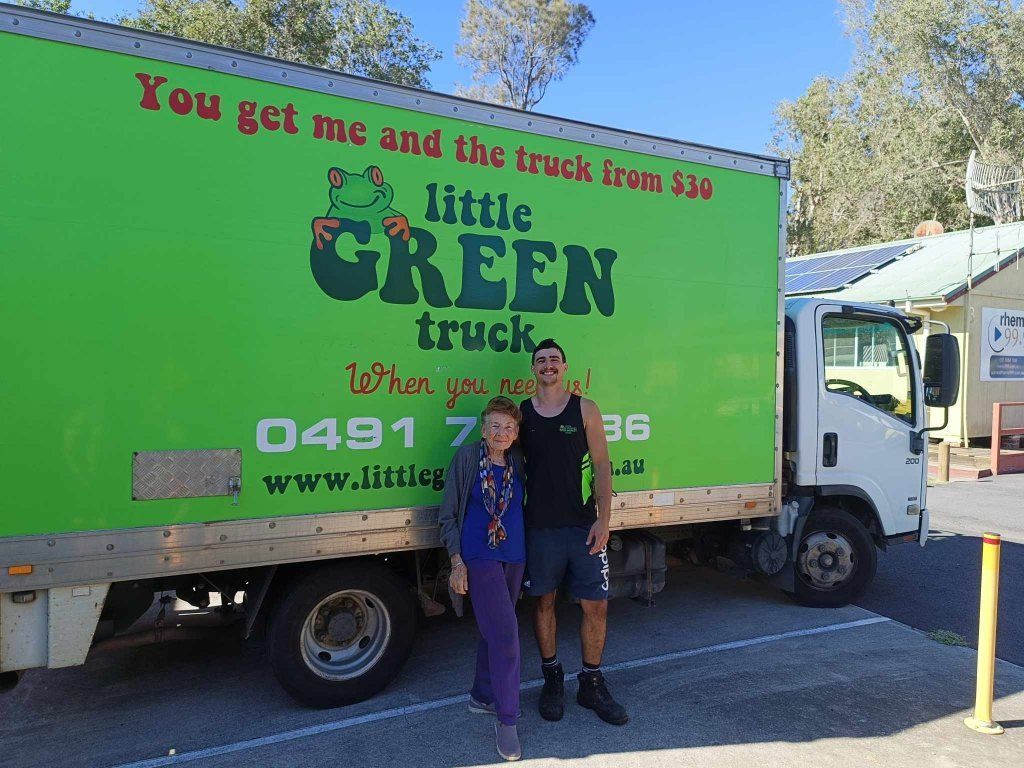 Two People Standing in Front of a Green Little Green Truck — Little Green Truck Port Macquarie in Lake Cathie, NSW