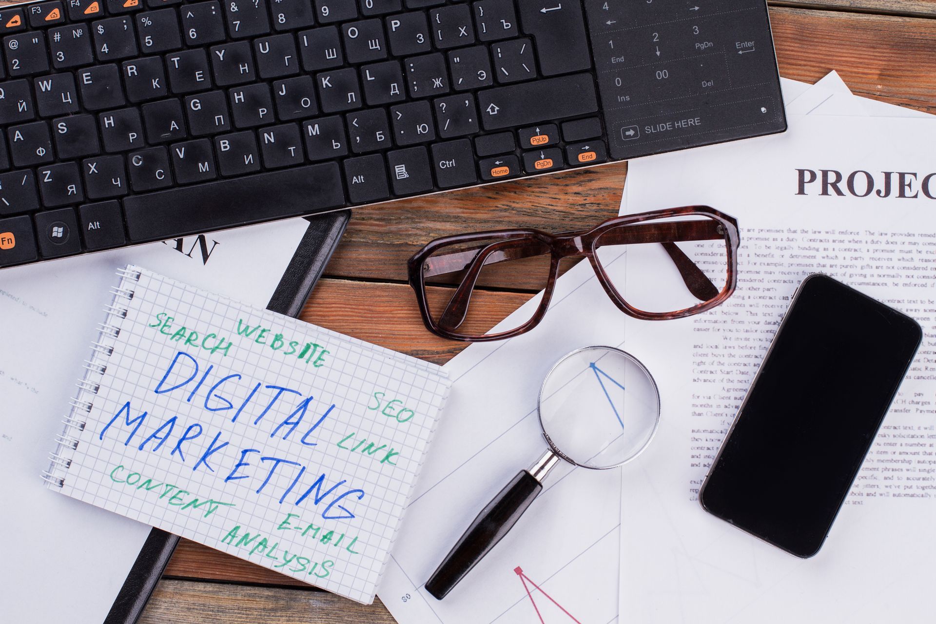 A notepad with the words digital marketing written on it
