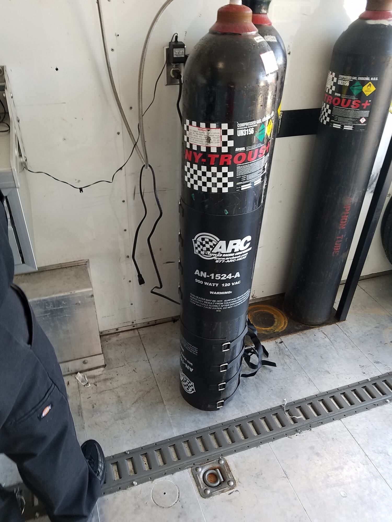 Black gas cylinder labeled 