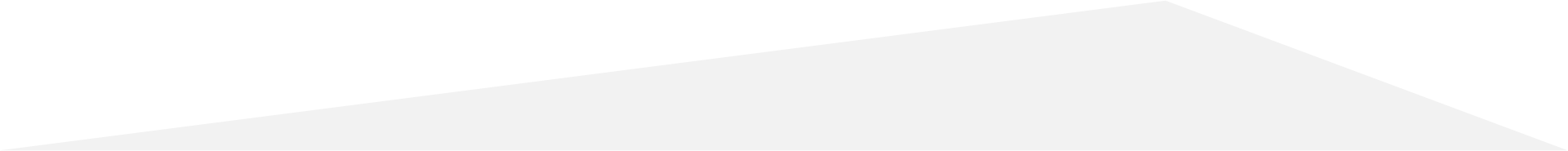 A white, slanted rectangular surface angled upward from bottom-left to top-right against a plain background.