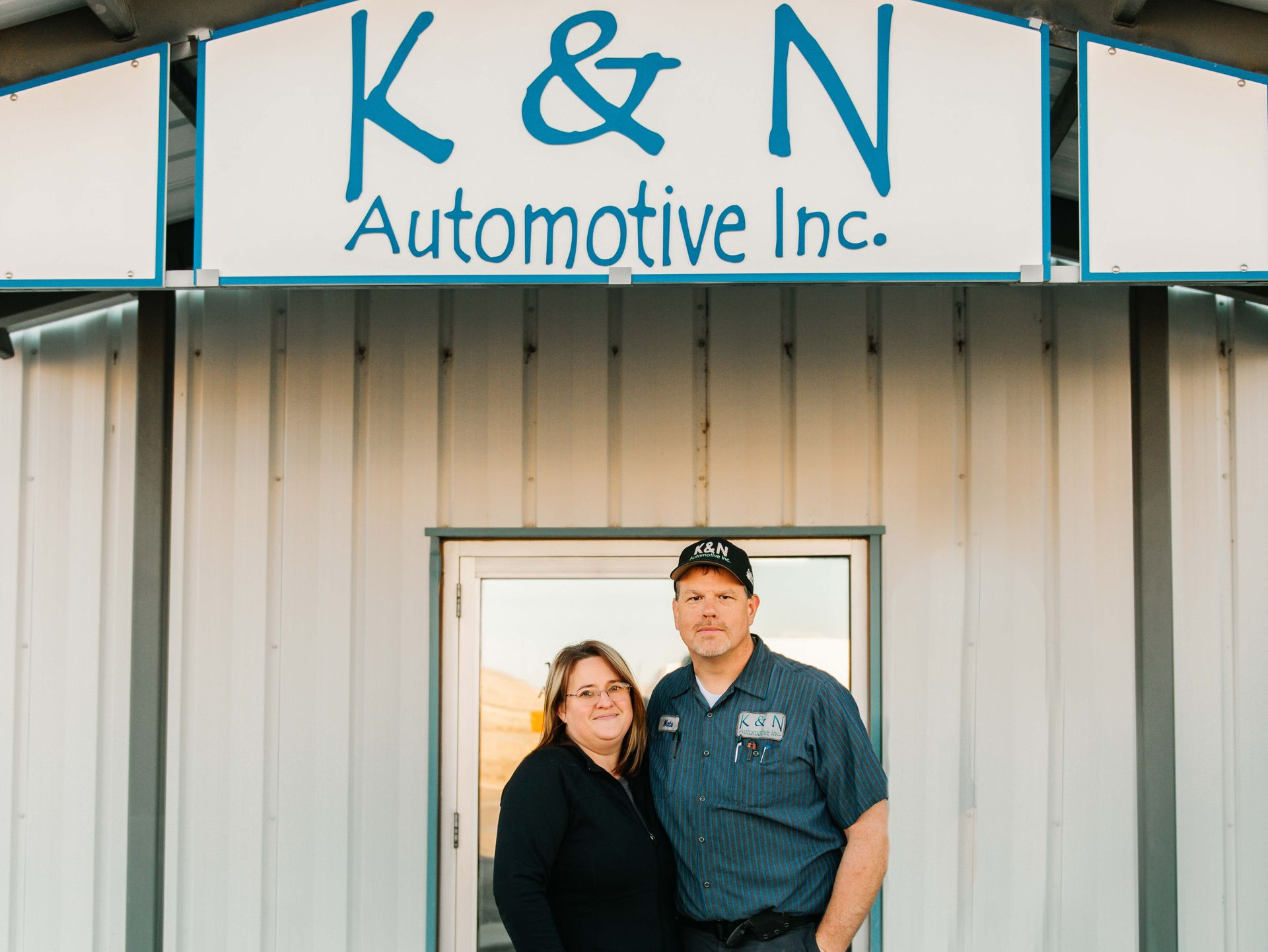 Owners in Front of the Shop | K & N Automotive Inc.