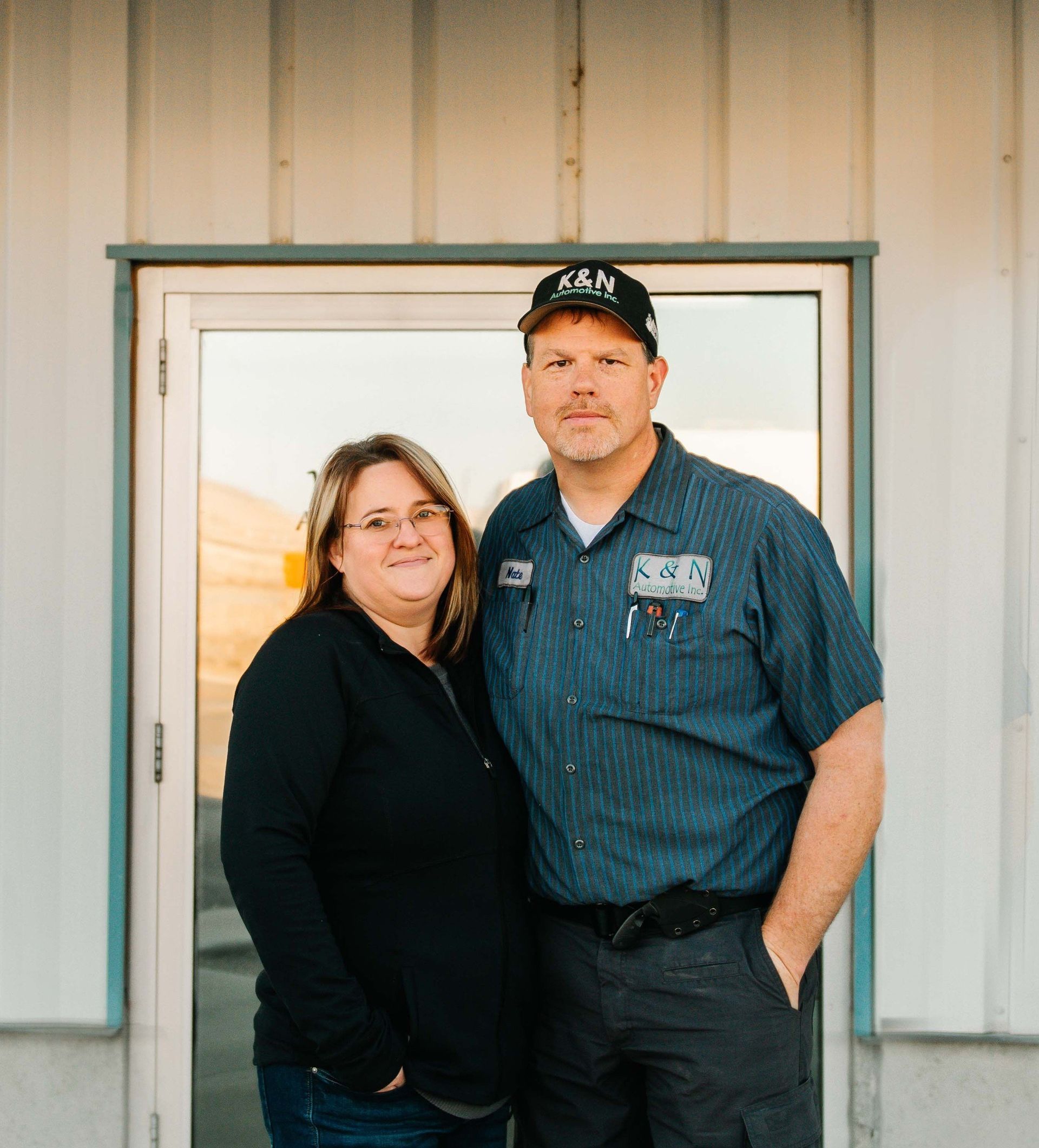 Owners in Front of the Auto Shop | K & N Automotive Inc.