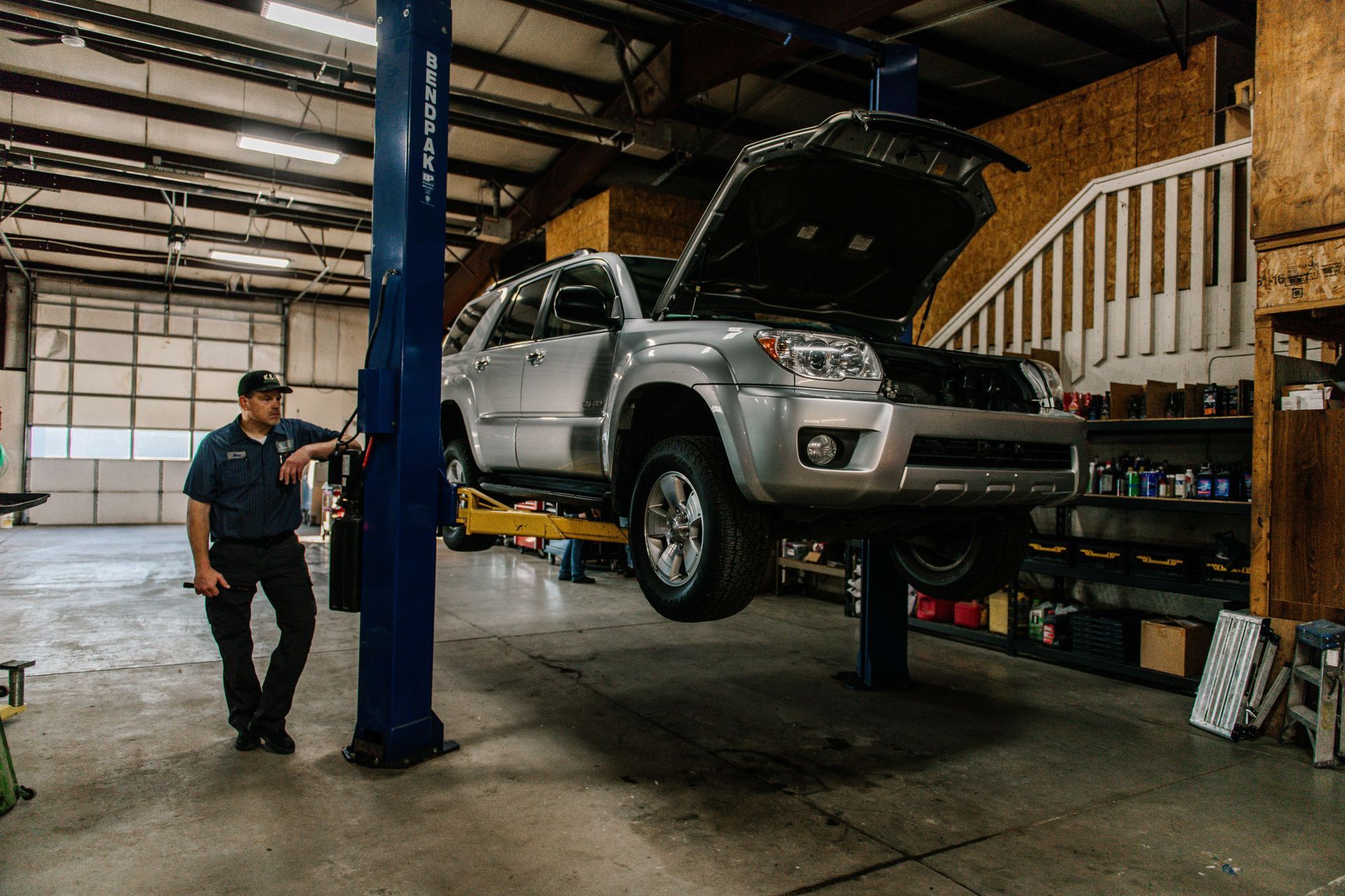 Owner Leans on Lift | K & N Automotive Inc.
