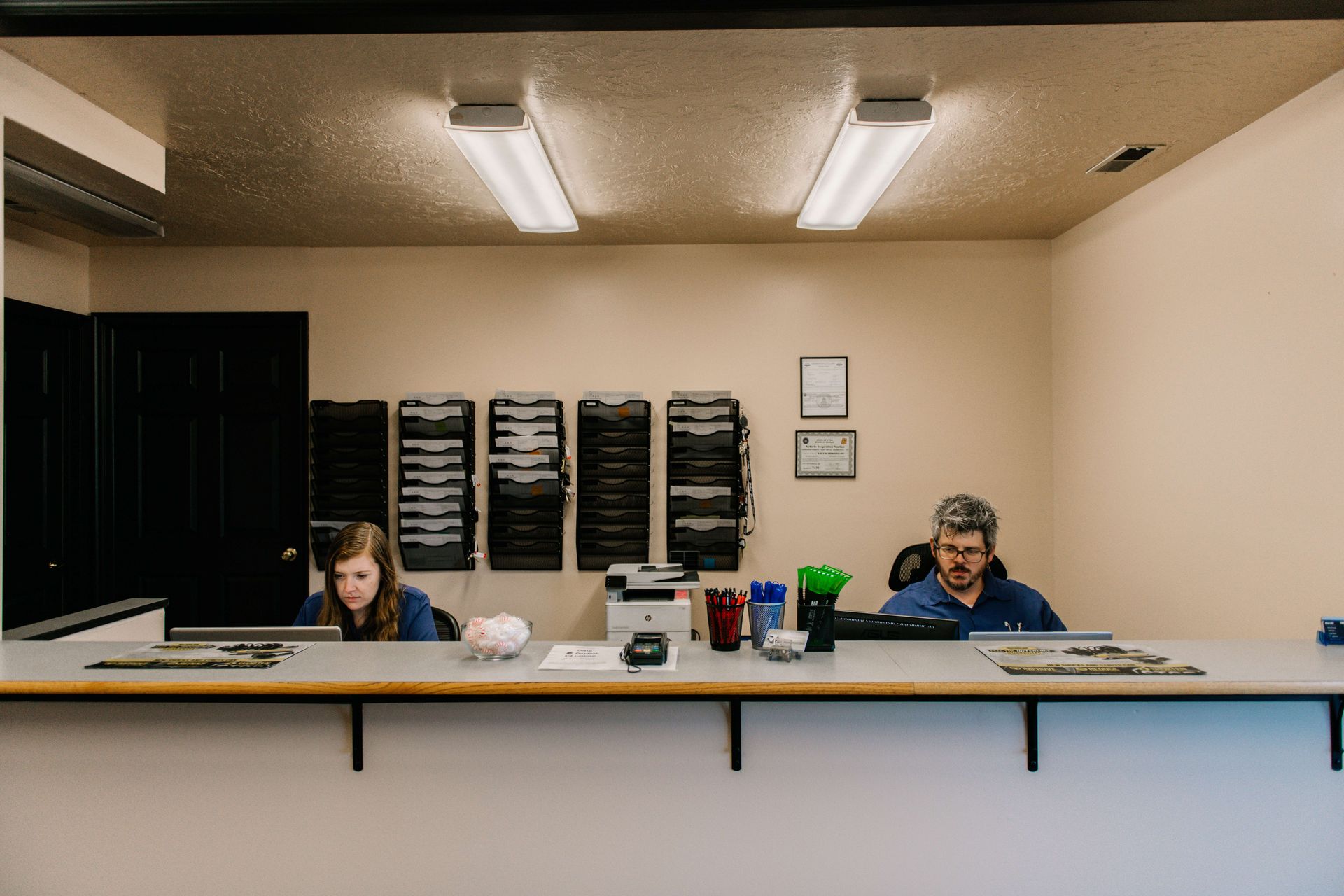 Team Members at Reception Desk | K & N Automotive Inc.