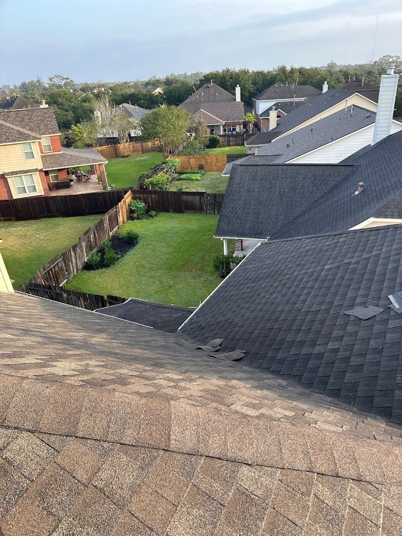 A view of a residential neighborhood from the roof of a house.