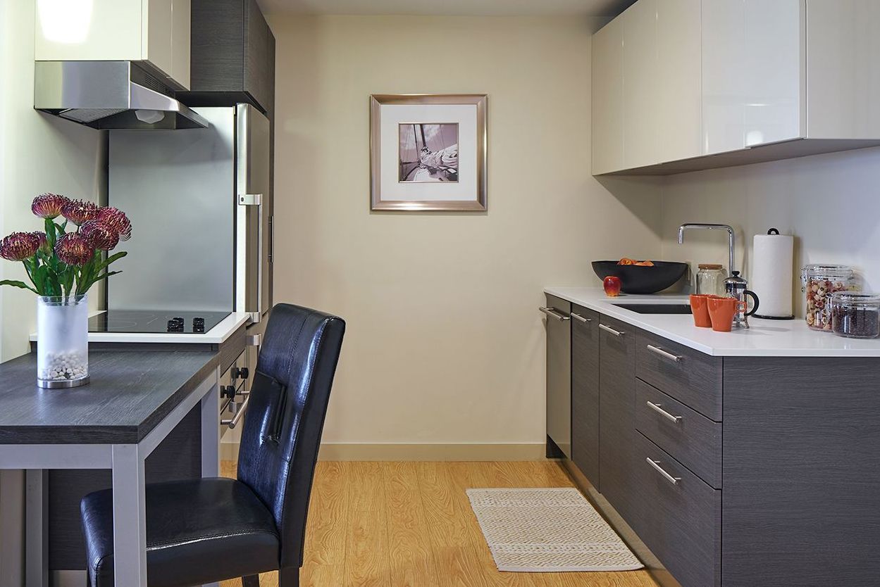 There is a large island in the middle of the kitchen.