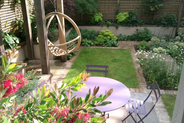 Clapham garden design, bistro set on patio surrounded by colour and scent