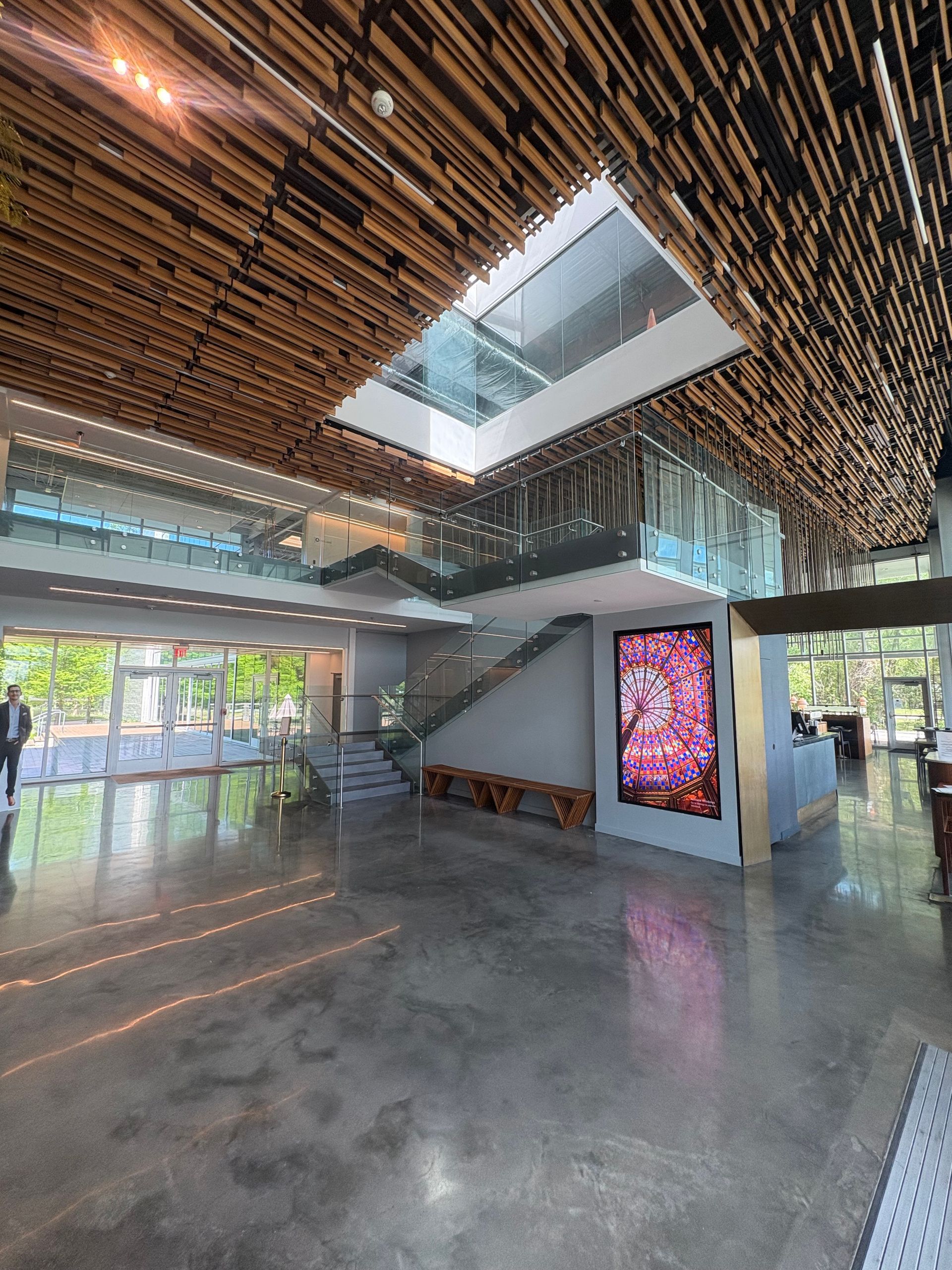 A bronze statue of Lady Justice holding a balanced set of scales in her left hand and a sword in her right.