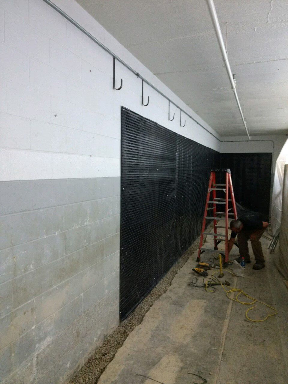 Installing Waterproofing Equipment — Canonsburg, PA — J&D Waterproofing & Home Improvements Inc.