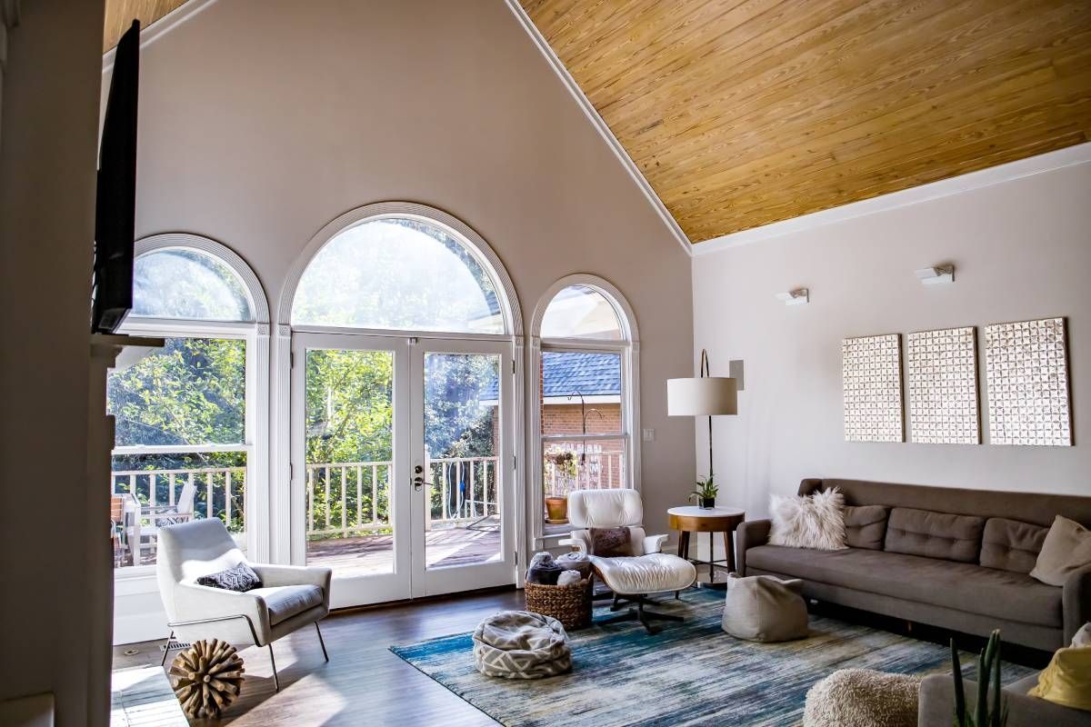 Beautiful arched windows and door inside a chic living room at Harmony Blinds & Shutters near San Diego, CA