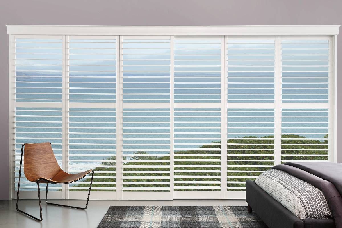 Hunter Douglas Palm Beach™ Polysatin™ Shutters decorating a coastal home bedroom at Harmony Blinds & Shutters near San Diego, CA